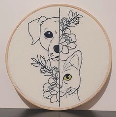 a cat and dog are depicted in this embroidery pattern