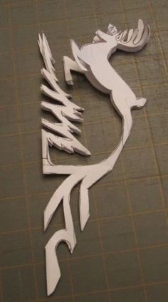 a cutout of a deer on a cutting board