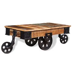 an old wooden table with wheels on it