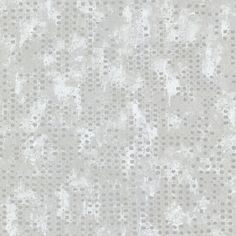 a white and gray wallpaper with small dots on the top right half of it