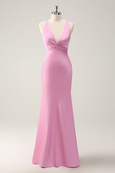 a pink dress on a mannequin with a halter top and low back