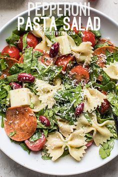 a white plate topped with pasta salad