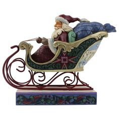 a figurine of santa riding in a sleigh