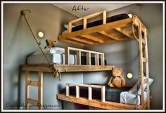 the bunk bed is made from wood and has two ladders on each side, along with a teddy bear