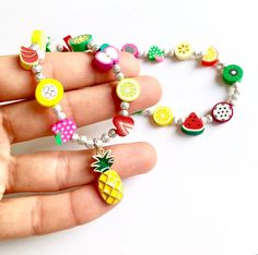 Hello everyone, welcome to my shop. This is a personalized/customized fruit stretch bracelet and necklace set for little girls. Perfect for girls as everyday summer jewelry. I will choose random fruits and ribbons to make your bracelet, I will always try to get as close as possible to original but stock may vary. I will need to know the name of your child (leave me a note at checkout section) and your child's wrist. (in inch- find your size in the menu) Can be made without the ribbon, leave me a Playful Jewelry With Fruit Design For Gift, Playful Summer Birthday Jewelry, Playful Fruit Design Jewelry For Gifts, Adjustable Fun Fruit Design Jewelry, Playful Pink Jewelry With Fruit Design, Cute Multicolor Fruit Design Jewelry, Fruit Bracelet, Summer Bracelets, Summer Jewelry