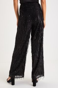 The most glamorous way to elevate any late-night look is with the Lulus Shimmery Aura Black Sequin Fringe High-Rise Wide-Leg Pants! Dazzling fringe-y sequin details adorn these mesh pants that feature a flattering high-rise fit and trendy wide pant legs that fall to full-length hems. Hidden side zipper/clasp. Pair with an equally shiny pair of heels for a truly stunning look! Fit: This garment fits true to size. Length: Ankle length. Size medium Inseam: 29.00 Front Rise: 12.50 Waist: Fitted - ve Elegant Bottoms For Night Out During Party Season, Glamorous Long Pants For Party, Elegant Sequinned Bottoms For Night Out, Elegant Sequined Bottoms For Holiday Party, Elegant Full Length Wide Leg Pants For Party, Chic Holiday Wide Leg Pants, Elegant High-waist Sequined Bottoms, Elegant High Waist Sequin Bottoms, Glamorous Formal Bottoms