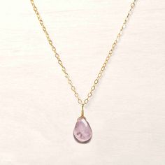 Minimalist • Classic • Versatile Handmade in our most signature style and original design, this simple rose quartz pendant necklace is perfect for every day wear. Rose quartz is the gemstone of love and a symbol for kindness. It opens the heart to give and receive love, bringing clarity to relationships making it the perfect gift for a loved one as a random act of kindness! Our handcrafted necklaces and pendants are wrapped in 14k gold filled or sterling silver wire making them the perfect daily Minimalist Rose Quartz Birthstone Jewelry, Minimalist Rose Quartz Gemstone Jewelry, Minimalist Teardrop Pendant Birthstone Necklace, Simple Everyday Gemstone Jewelry, Minimalist Rose Quartz Pendant Necklace, Everyday Rose Quartz Gemstone Jewelry, Pink Minimalist Jewelry As A Gift For Her, Everyday Pink Charm Necklaces, Minimalist Pink Rose Quartz Jewelry