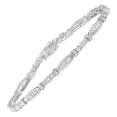 Deluxe tennis bracelet featuring a geometric pattern embellished with 86 genuine diamonds and made with 10k white gold. It presents a 3ct total diamond weight and two different diamond shapes, one with a round cut and a prong setting and the other with a baguette cut and a channel setting. This 7-inch long bracelet includes a box with clasp and a gifting packaging. Perfect choice for any formal event or occasion. Bracelet has 86 natural, round diamonds. Each stone weighs approximately 0.08 for a Gifting Packaging, Long Bracelet, 3 Carat Diamond, Channel Setting, Brown Diamond, Women Diamond, Tennis Bracelet Diamond, Baguette Cut, Tennis Bracelet