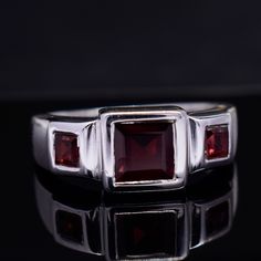 Large Garnet Ring, Handmade Red Garnet Ring, Gemstone Jewelry, 925 Sterling Silver & 18k Gold Fill, Faceted Square Ring, Signet Garnet Ring Description :- Metal :- 925 Sterling Silver/ 18k Gold Filled  Gemstone :- Natural Red Garnet  Stone Shape :- Square Stone Color :- Red   Handmade Items **Made to Order** Delivery Time:- Once Item is shipped parcel will be delivered to you in 2-4 weeks. C U S T O M I Z E O R D E R  All jewelry are made with solid 925 sterling silver. If you want to make any changes in this jewelry, then please send us a message. We accept custom orders also. All jewelry are nickle free. Visit our shop : https://www.etsy.com/in-en/shop/MiharSilverCrafts Formal Red Ruby Ring With Three Stones, Formal Ruby Three Stone Ring, Formal Red Three Stone Ruby Ring, Classic Red Three Stone Rings, Classic Red Three-stone Ring, Classic Three Stone Jewelry With Lab-created Ruby, Formal Red Birthstone Ring With Polished Finish, Three Stone Classic Jewelry With Lab-created Ruby, Classic Three Stone Lab-created Ruby Jewelry