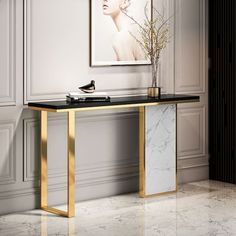 a marble and gold console table with a plant in the corner next to an art piece