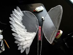 two angel wings sitting on top of a table