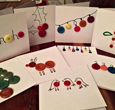 several cards with buttons and christmas decorations on them