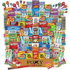 a large box filled with lots of different types of snacks and candy bars on top of each other