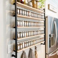 an organized pantry is shown in this kitchen