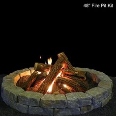 a fire pit with logs burning in it