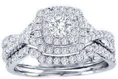 an engagement ring set with two diamond halos on each band and a matching wedding band