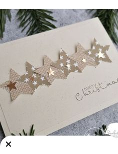 a christmas card with gold stars on it