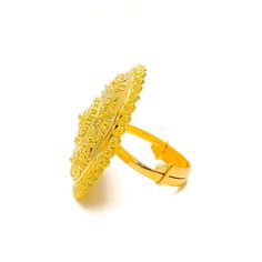 This 22k gold statement ring is a versatile and glamorous piece, weighing 9.0 grams with a polished yellow gold finish. With a 1.1-inch diameter, it fits a ring size of 6.25, adjustable from 5.25 to 7.25. The ring’s sleek and elegant design makes it a perfect accessory for any occasion, offering both style and adaptability. Ideal for those who appreciate understated luxury, this ring is a timeless addition to any jewelry collection. PRODUCT DETAILS Gold Purity(karat): 22k Gold Weight(grams): 9.0 Item Finish: Yellow Gold Ring Size: 6.25 Ring Diameter: 1.1" Adjustable Ring: Yes, Size 5.25 - 7.25 Adjustable Gold Dome Ring For Formal Occasions, Adjustable Gold Engraved Ring For Formal Occasions, Gold Open Ring Filigree For Formal Occasions, Gold Open Filigree Ring For Formal Occasions, Adjustable Gold Filigree Rings, Traditional Gold Engraved Ring For Formal Occasions, 22k Gold Open Ring Jewelry, Traditional Gold Plated Rings For Formal Occasions, Ceremonial Adjustable Gold Engraved Ring