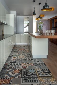 an image of a kitchen setting with tile flooring and wood accents on the walls