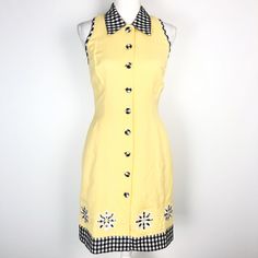 "Vintage Plaza South Linen Button Front Dress in Yellow - Size 4 Pale yellow sleeveless linen blend dress Black and white gingham details at collar, trim and buttons Embroidered applique gingham daisies at bottom hem Hourglass sheath silhouette Full button front with gingham covered buttons Fully lined Excellent pre-owned vintage condition Chest (flat) - 16\" Waist (flat) - 13\" Length from underarm - 27\" Please contact me with any questions!" Collared Gingham Dress For Spring, Spring Button-up Gingham Dresses, Summer Gingham Dress With Button Closure, Retro Gingham Dress With Buttons, Retro Yellow Dress For Picnic, Yellow Sleeveless Dress With Button Closure, Gingham Dresses With Buttons For Spring, Sleeveless Gingham Dress With Buttons, Spring Gingham Dresses With Buttons