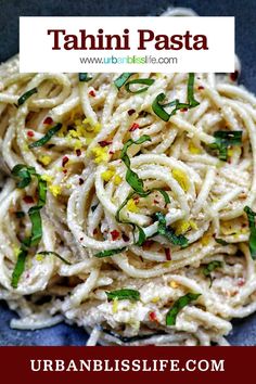 this is an image of a pasta dish with herbs and lemon zest on top