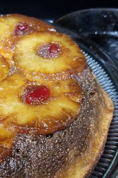 a pineapple upside down cake on a cooling rack