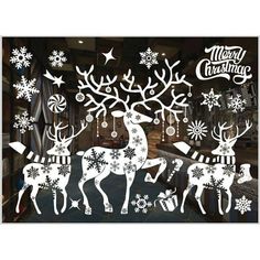 christmas window stickers with reindeers and snowflakes on them in the background