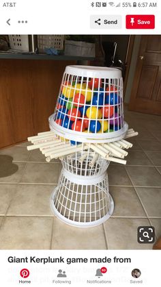 a white basket filled with lots of colorful candies on top of a tiled floor