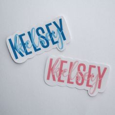 two stickers with the words kelsey and kelsey painted on them