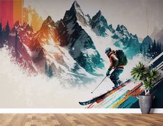 a man riding skis on top of a wooden floor next to a wall mural