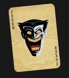 a joker playing card with an evil face