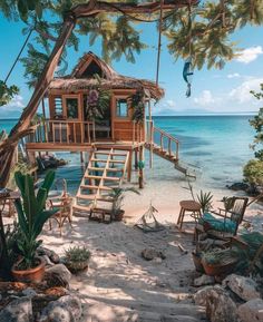 a tree house sitting on top of a sandy beach