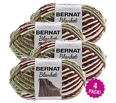 three balls of bernat black label yarn, each with different colors and patterns on them