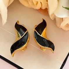 These gorgeous earrings look beautiful on. Gold plated with gorgeous black enamel-vintage from the 1960s. Earring length: 3.5cm. Earring width: 1.2cm. www.vintageamara.co.uk 1950s Earrings, Lucky Horseshoe, Flower Clip, Pretty Rings, The 1960s, Gorgeous Earrings, Black Enamel, Clip On, Clip On Earrings