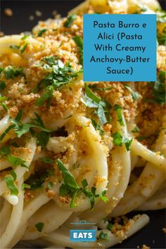 pasta with parmesan cheese and herbs on top, in a black plate text reads pasta bura e alci pasta with creamy & creamy anchovy - butter sauce