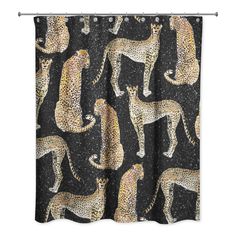 a shower curtain with cheetah and leopards printed on the fabric in black