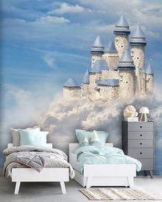 a bedroom with a castle mural on the wall and a bed in front of it