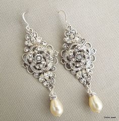 "These vintage style earrings have Victorian style rose pendants in silver finish and Austrian pearls in your choice of color. I have used premium Austrian crystals and pearls to complete this vintage look. Earrings measure approximately 3\" long from top to bottom and have silver plated hook ear wires. Let me know at checkout your color preference for finish and pearls. **Each premium Austrian crystal is handset in our home studio by us, proudly made in the US** ** Divine Jewel is the original Wedding Pearl Chandelier Earrings In Silver, Silver Pearl Chandelier Earrings For Wedding, Wedding Chandelier Earrings In Silver With Pearls, Silver Pearl Chandelier Earrings For Anniversary, Delicate Silver Pearl Earrings For Wedding, Ornate Silver Chandelier Earrings With Pearl Drop, Silver Pearl Drop Bridal Earrings For Wedding, Delicate Silver Chandelier Earrings For Anniversary, Ornate Silver Chandelier Earrings For Wedding