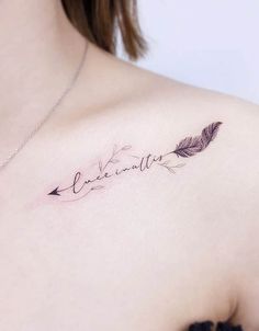 a woman's chest with an arrow and the word love written in cursive writing