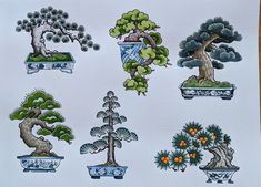 a bunch of bonsai trees are shown on a piece of paper