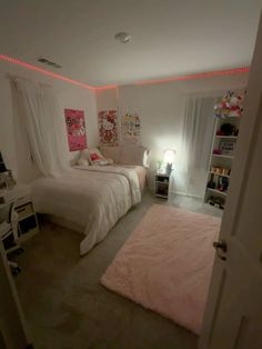 a bedroom with two beds and pink rugs