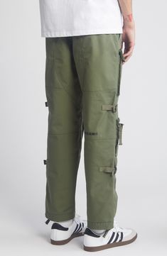 These ultramodern pants are big, baggy and boast multiple pockets to keep your stuff easy to access. 29" inseam; 16" leg opening; 12" front rise; 16" back rise (size 32) Elastic/drawstring waist Cargo snap-patch pockets; cargo zip patch pockets Drawstring hems 65% polyester, 35% cotton Hand wash, line dry Black Owned/Founded Bag Pants, Big Bag, Big Bags, Four Leaf, Leaf Clover, Four Leaf Clover, Drawstring Waist, Patch Pocket, Hand Wash