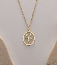 Gold Scorpion Pendant - Scorpion Gold Necklace ● Material of pendant: Solid Gold 14k ( REAL GOLD ) ● Metal Stamp: 14k ( REAL GOLD ) ● The pendant is available in 5 sizes: - 12x17 mm / 0,47 x 0,66 inches - 13x18 mm / 0,51 x 0,70 inches  In the photos - 14x19 mm / 0,55 x 0,74 inches  - 16x21 mm / 0,62 x 0,82 inches  - 18x24 mm / 0,70 x 0,94 inches ( In the photos the size is 13x18 mm / 0,51 x 0,70 inches ) ( Jump Ring inner diameter: 4 mm ) ● Material of chain: Solid gold 14k ( REAL GOLD ) It is thin and dainty and it is available in 4 sizes: - 40 cm / 15,75 inches ( Length ) - 45 cm / 17,72 inches ( Length ) In the photos - 50 cm / 19,68 inches ( Length ) - 55 cm / 21,65 inches ( Length ) ● Backside engraving is FREE ( Please use the personalization box for that.) ● If you want larger size, Gold Zodiac Sign Necklaces For Birthday, Gold Zodiac Sign Necklaces For Birthdays, Gold Oval Necklace For Birthday, Gold Oval Pendant Jewelry For Birthday, Gold Scorpion, Scorpion Necklace, Gold Birthday, Jump Rings, Metal Stamping