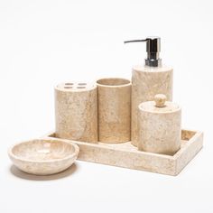 marble bathroom accessories including soap dispenser and dish