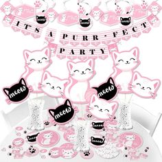 pink kitty party decorations and tableware for a cat themed birthday or baby's first birthday