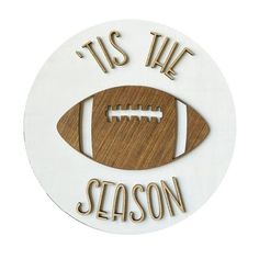 a wooden sign that says tis the season with a football on it