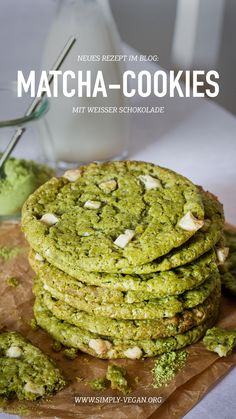 a stack of cookies sitting on top of a wooden cutting board