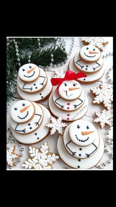 cookies decorated like snowmen on a table