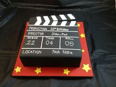 a birthday cake made to look like a movie clapper