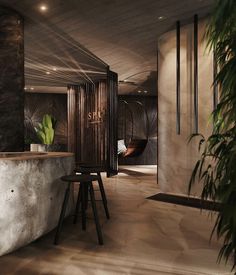 the interior of a modern hotel with marble counter tops and plant pots on stools